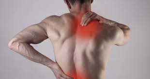man have a showing in a muscle pain in a back pain.